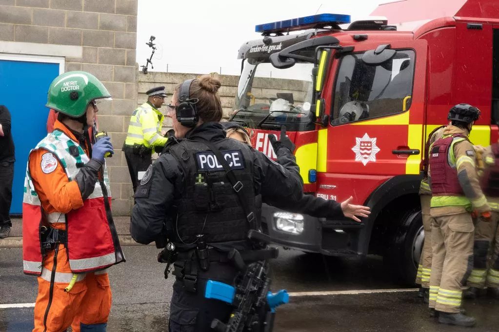 Police, fire and medical responders working together during a multi-agency exercise